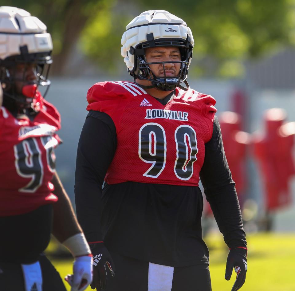 Louisville defensive lineman Jermayne Lole participates in drills on the first day of football practice.