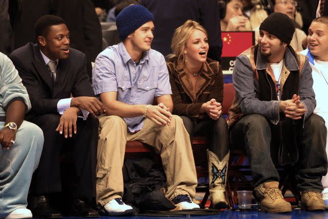 <p>Scott Gries/NBAE/Getty</p> Chris Tucker, Justin Timberlake, Britney Spears and Chris Kirkpatrick in February 2002