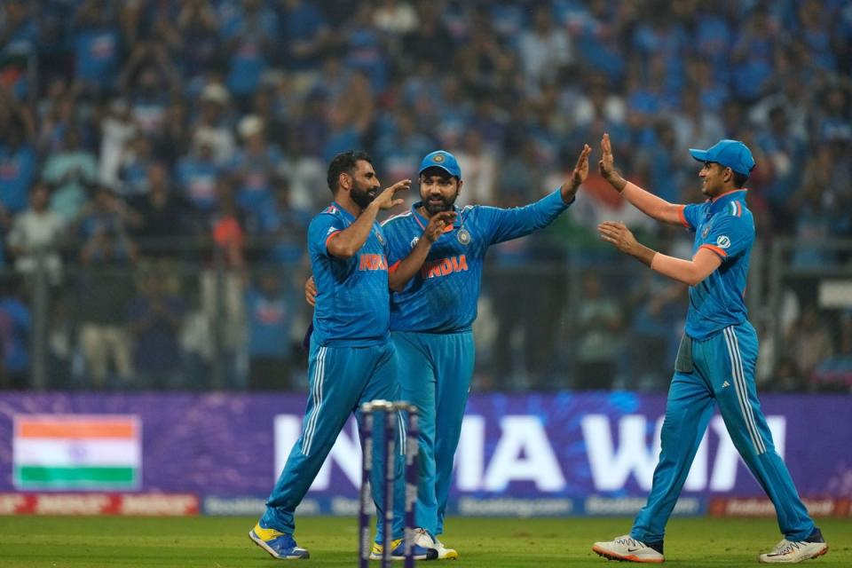 India’s captain Rohit Sharma (centre) felt his side dug in to see off New Zealand and book their place in the World Cup final (Rajanish Kakade/AP) (AP)