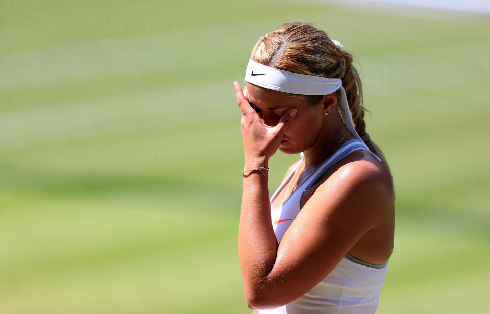 Germany's Sabine Lisicki reacts during her match against France's Marion Bartoli during day twelve of the Wimbledon Championships at The All England Lawn Tennis and Croquet Club, Wimbledon.