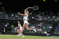 Australia's Storm Hunter and Belgium's Elise Mertens, front, in action against Barbora Strycova of the Czech Republic and Taiwan's Hsieh Su-Wei in the final of the women's doubles on day fourteen of the Wimbledon tennis championships in London, Sunday, July 16, 2023. (AP Photo/Kirsty Wigglesworth)