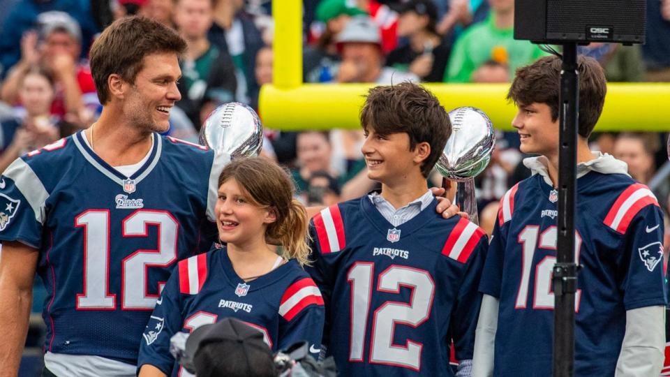 PHOTO: Tom Brady stands with his three children, Vivian, left, Benjamin, center, and Jack, during half time of the home opening game for the New England Patriots, Sept. 10, 2023, in Foxborough, Mass. (Joseph Prezioso/AFP via Getty Images, FILE)