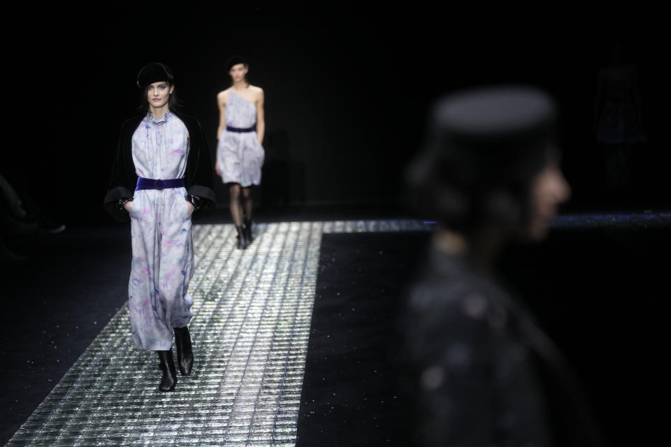 Models wear creations part of the Emporio Armani women's Fall-Winter 2024-25 collection presented in Milan, northern Italy, Thursday, Feb. 22, 2024. (AP Photo/Luca Bruno)