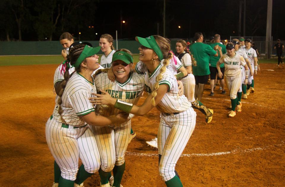 Members of the Fort Myers High School softball team celebrate 3-2 win over East Bay High School during a regional softball game at Fort Myers on Thursday, May 9, 2024.
