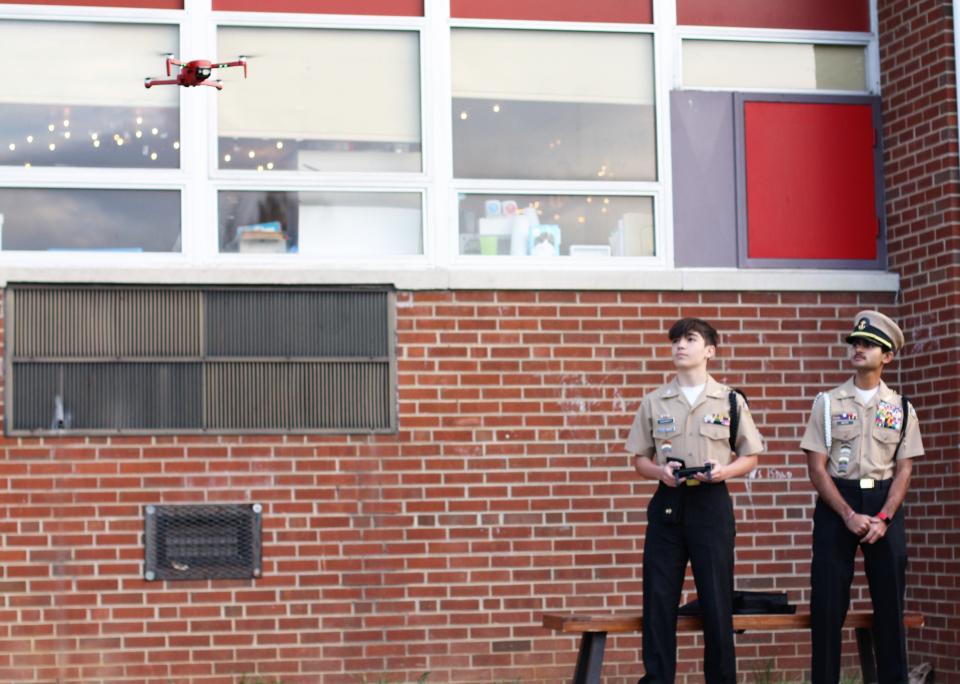 Central High School JROTC freshman Brodie Trave Hackworth and senior Deep Mistry fly a drone for members of the fifth-grade boy’s leadership group at Inskip Elementary School, March 30, 2022. Central’s JROTC program activities include interschool competitive drone flying. March 30, 2022.