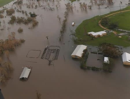 Damaged and flooded areas can be seen from an Australian Army helicopter after Cyclone Debbie passed through the area near the town of Bowen, located south of the northern Queensland town of Townsville in Australia, March 30, 2017. REUTERS/Gary Ramage/Pool