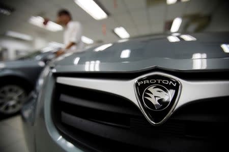 Malaysian-made Proton cars are seen on display at a Proton showroom in Kuala Lumpur January 16, 2012. REUTERS/Bazuki Muhammad/File Photo