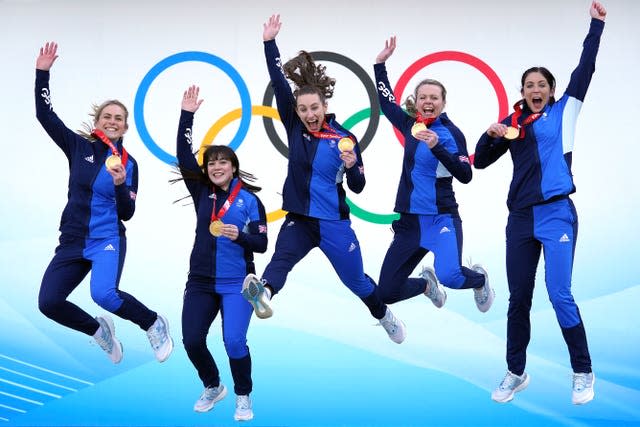 Great Britain’s Olympic gold medal-winning women’s curling team of Mili Smith, Hailey Duff, Jennifer Dodds, Vicky Wright and Eve Muirhead jump for joy after topping the podium at the Beijing Winter Olympics courtesy of victory over Japan. The quintet's success in February was later recognised in the Queen’s Birthday Honours list. Captain Muirhead, already an MBE, was made an OBE, while Dodds, Duff, Wright and alternate Smith were each made MBEs