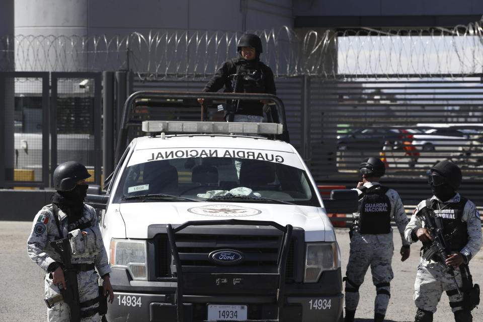 Mexican National Guard stand guard outside the Almoloya prison where Ovidio Guzman, the son of imprisoned drug lord Joaquin “El Chapo” Guzman, is being held in Villa de Almoloya de Juarez, Mexico, Friday, Jan. 6, 2023. (AP Photo/Ginnette Riquelme)