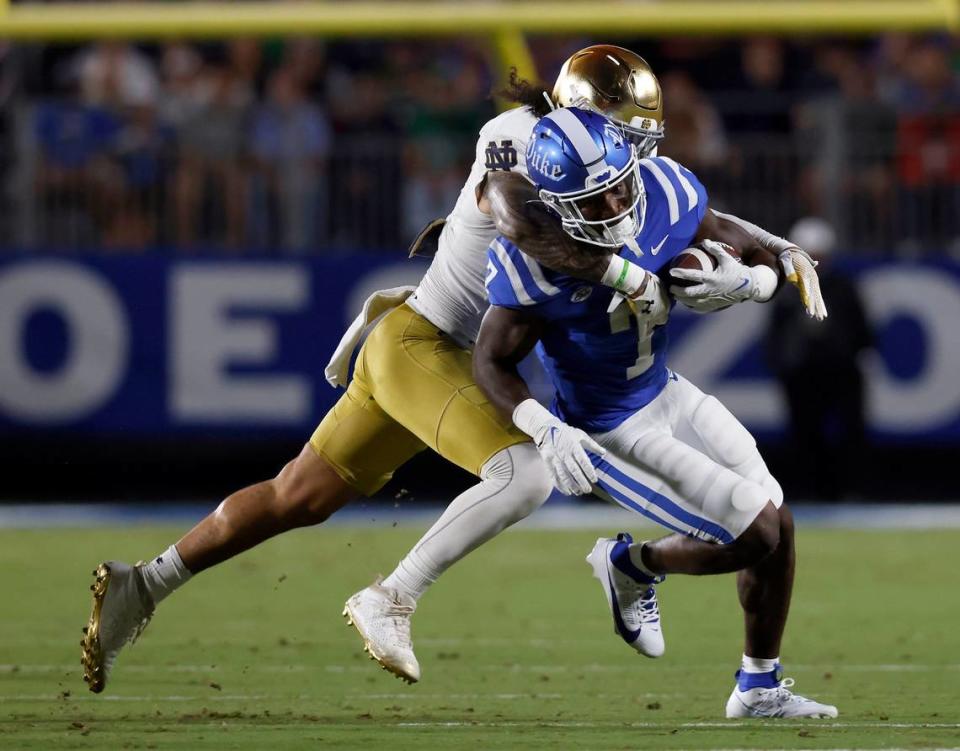 Duke’s Jordan Waters is brought down by Notre Dame’s Marist Liufau during the first half of the Blue Devils’ game at Wallace Wade Stadium on Saturday, Sept. 30, 2023, in Durham, N.C.