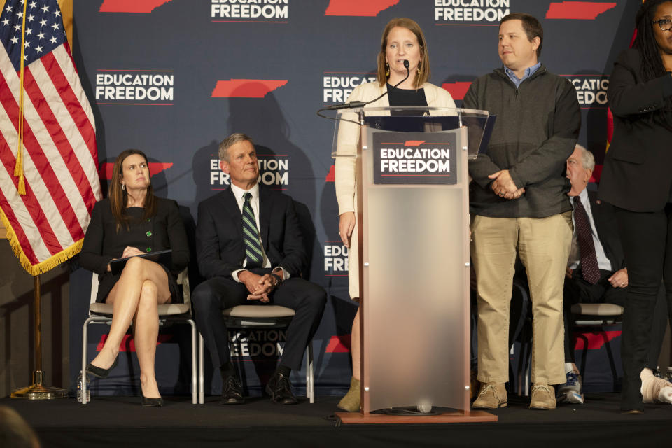 Brooke and Steven Edging, right, speak in support of school voucher legislation during a news conference as Arkansas Gov. Sarah Huckabee Sanders, left, and Tennessee Gov. Bill Lee, listen Tuesday, Nov. 28, 2023, in Nashville, Tenn. Gov. Lee presented the Education Freedom Scholarship Act of 2024, his administration's legislative proposal to establish statewide universal school choice. (AP Photo/George Walker IV)