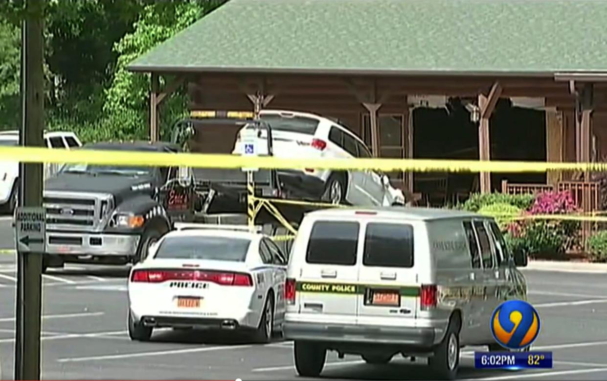 An SUV being towed from the scene where Roger Self intentionally rammed his vehicle into a restaurant busy with a lunchtime crowd: AP