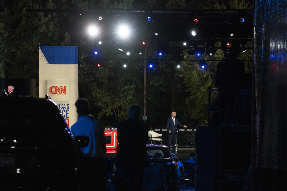 Audience members watch from their cars as Democratic presidential candidate former Vice President Joe Biden speaks during a CNN town hall moderated by Anderson Cooper in Moosic, Pa., Thursday, Sept. 17, 2020. (AP Photo/Carolyn Kaster)