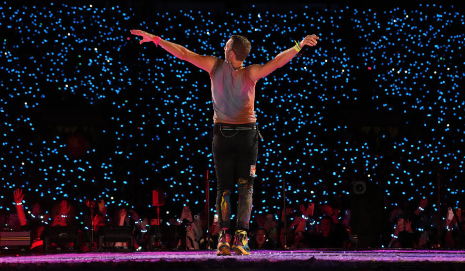 Chris Martin of Coldplay performs at the Rose Bowl, Saturday, Sept. 30, 2023, in Pasadena, Calif. (AP Photo/Chris Pizzello)