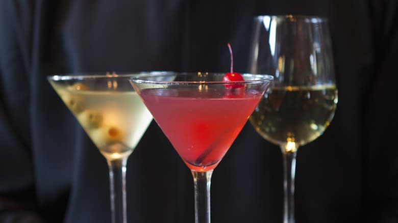 Closeup of two martinis and a wine glass