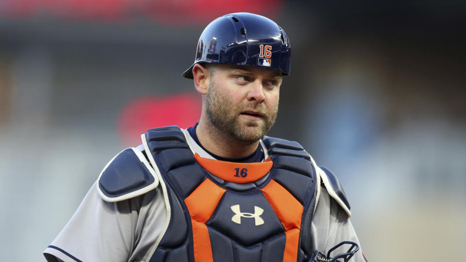 FILE- In this April 10, 2018, file photo, Houston Astros catcher Brian McCann watches in the first inning of a baseball game against the Minnesota Twins in Minneapolis. A person familiar with the negotiations tells The Associated Press that McCann has agreed to return to the Atlanta Braves for a $2 million, one-year contract. The person spoke on condition of anonymity Monday, Nov. 26, 2018, because the agreement had not yet been announced. (AP Photo/Jim Mone, File)