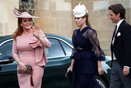 Britain's Sarah, Duchess of York, waves as she arrives with Princess Beatrice and Edoardo Mapelli Mozzi ahead of the wedding of Lady Gabriella Windsor and Thomas Kingston at St George's Chapel in Windsor Castle, in Windsor Castle, near London, Britain May 18, 2019. Frank Augstein/Pool via REUTERS