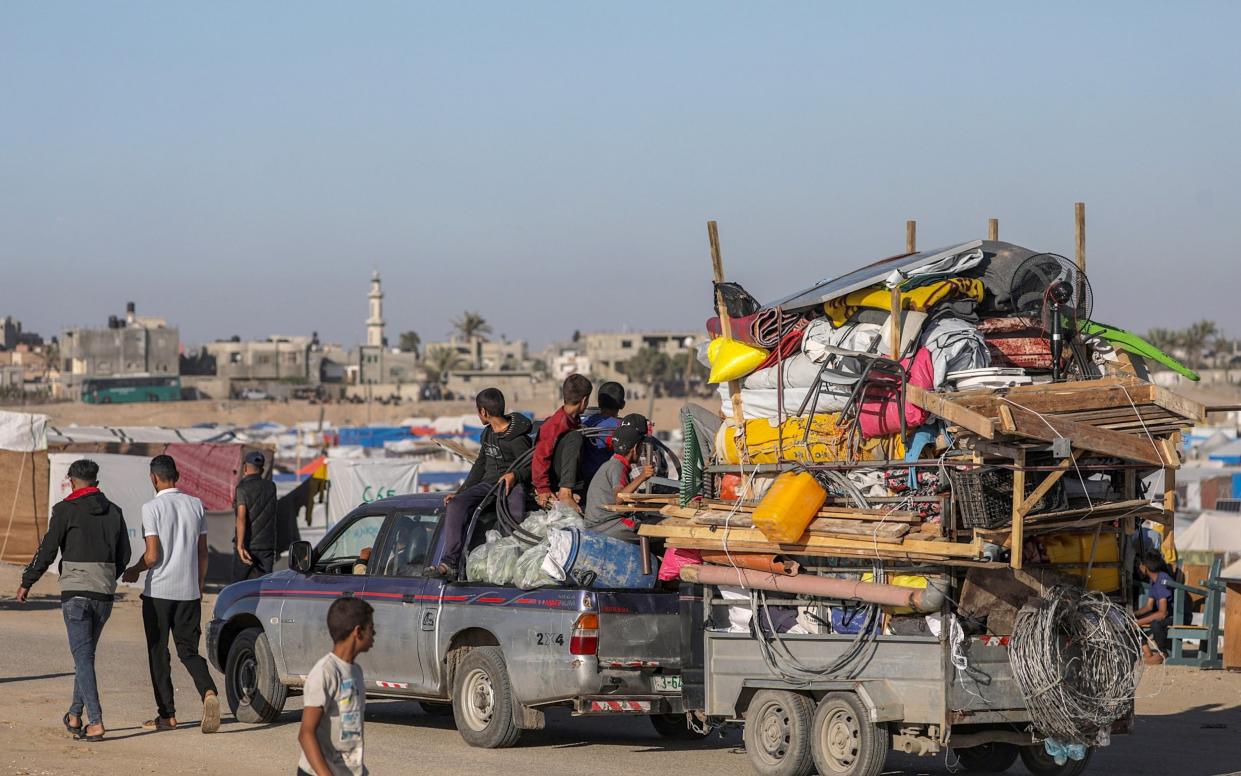 Internally displaced Palestinians leave with their belongings following an evacuation order issued by the Israeli army, in Rafah, southern Gaza Strip
