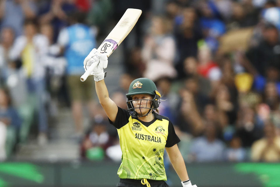 Alyssa Healy (pictured) raises her bat after reaching fifty runs during the ICC Women's T20 Cricket World Cup Final.