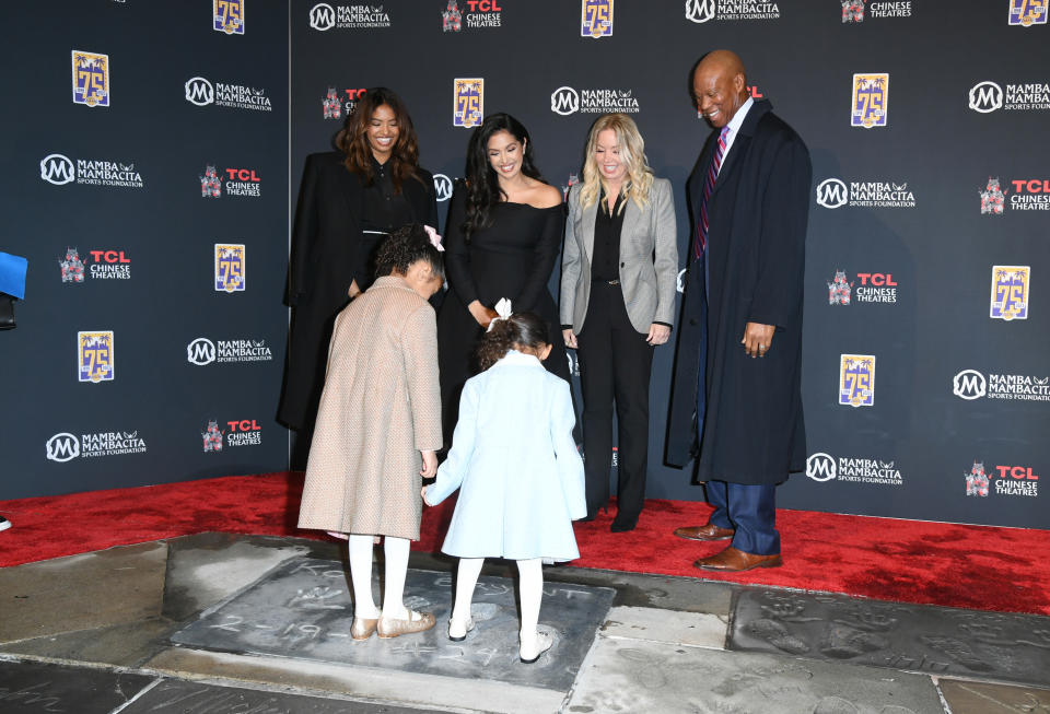 HOLLYWOOD, CALIFORNIA – MARCH 15: (L-R) Natalia Bryant, Vanessa Bryant, Bianka Bryant, Capri Bryant, Jeanie Buss and Byron Scott attend a ceremony unveiling and permanently placing Kobe Bryant’s hand and footprints in the forecourt of the TCL Chinese Theatre on March 15, 2023 in Hollywood, California. (Photo by JC Olivera/Getty Images)