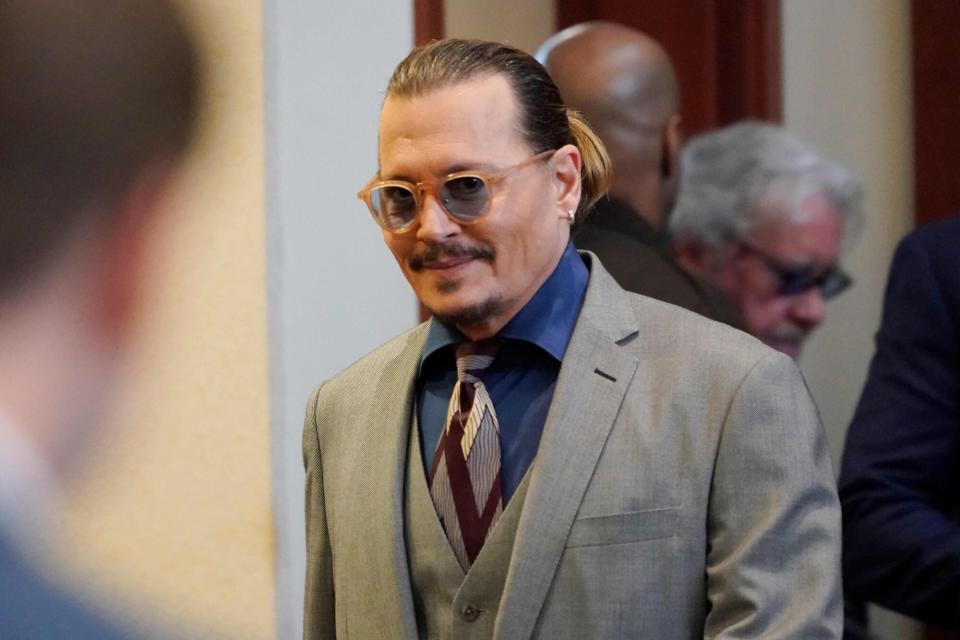 Actor Johnny Depp arrives into the courtroom at the Fairfax County Circuit Courthouse in Fairfax, Virginia, on May 16, 2022. - Actor Johnny Depp sued his ex-wife Amber Heard for libel in Fairfax County Circuit Court after she wrote an op-ed piece in The Washington Post in 2018 referring to herself as a 