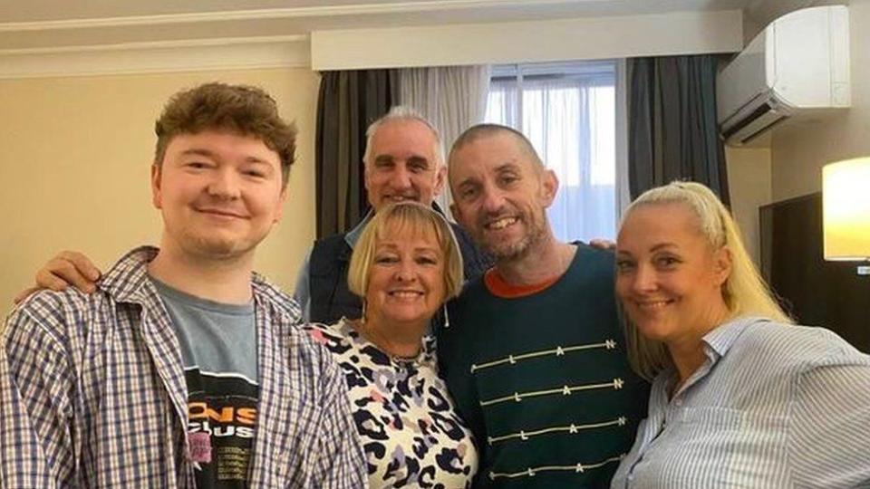 Shaun Pinner (dark top) pictured back in the UK with his family (Debbie Price)