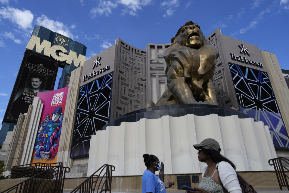 People walk by the MGM Grand hotel-casino Wednesday, Sept. 13, 2023, in Las Vegas. A "cybersecurity issue" led to the shutdown of some casino and hotel computer systems at MGM Resorts International properties across the U.S., a company official reported Monday, Sept. 11, 2023. (AP Photo/John Locher)