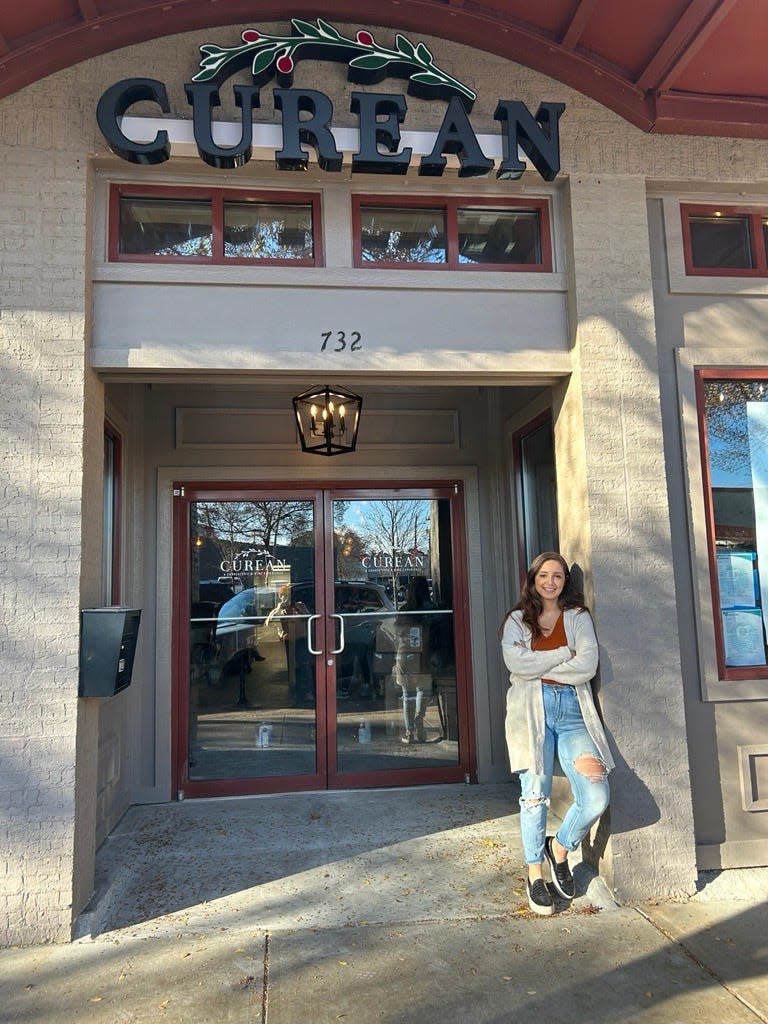 Vickie Zambrano, owner of Curean, stands in front of her new storefront which is slated to open late December 2023 or early January 2024.