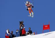 Norway's Aksel Lund Svindal goes airborne during the downhill run of the men's alpine skiing super combined event at the 2014 Sochi Winter Olympics at the Rosa Khutor Alpine Center February 14, 2014. REUTERS/Stefano Rellandini