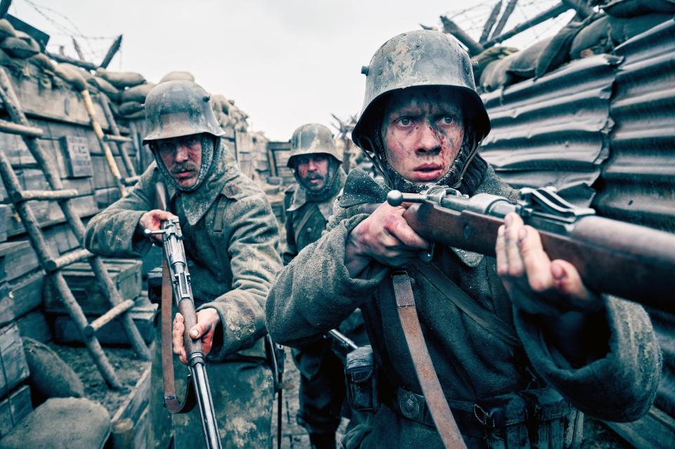 Albrecht Schuch and Felix Kammerer walk down a trench