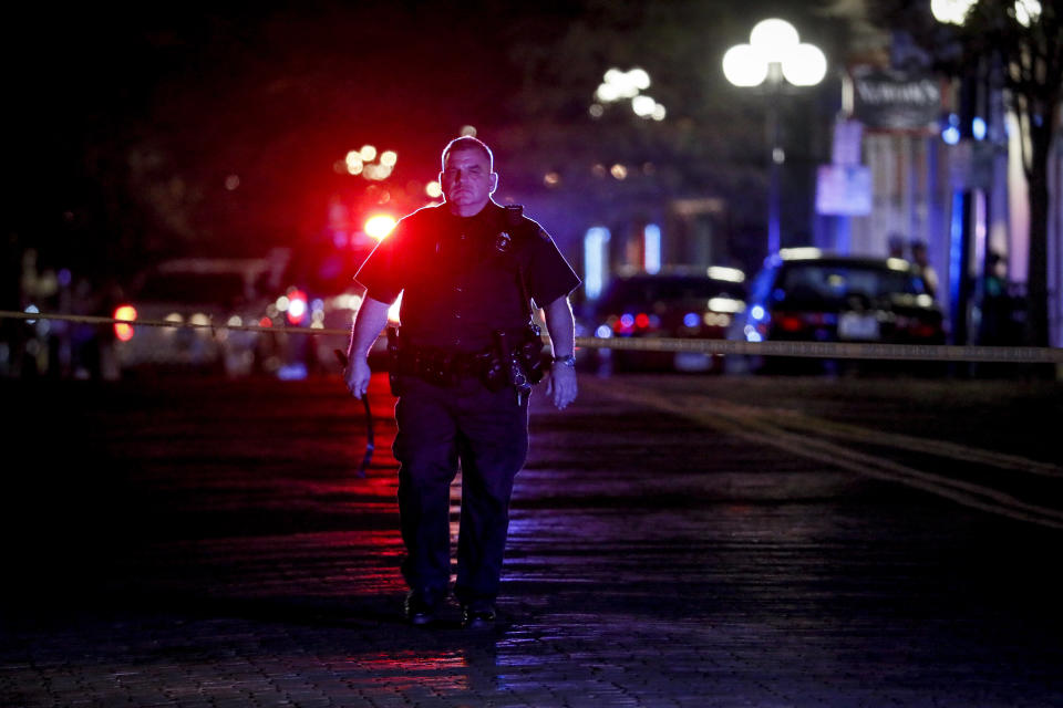 Authorities work at the scene of a mass shooting, Sunday, Aug. 4, 2019, in Dayton, Ohio. Several people in Ohio have been killed in the second mass shooting in the U.S. in less than 24 hours, and the suspected shooter is also deceased, police said. (Photo: John Minchillo/AP)