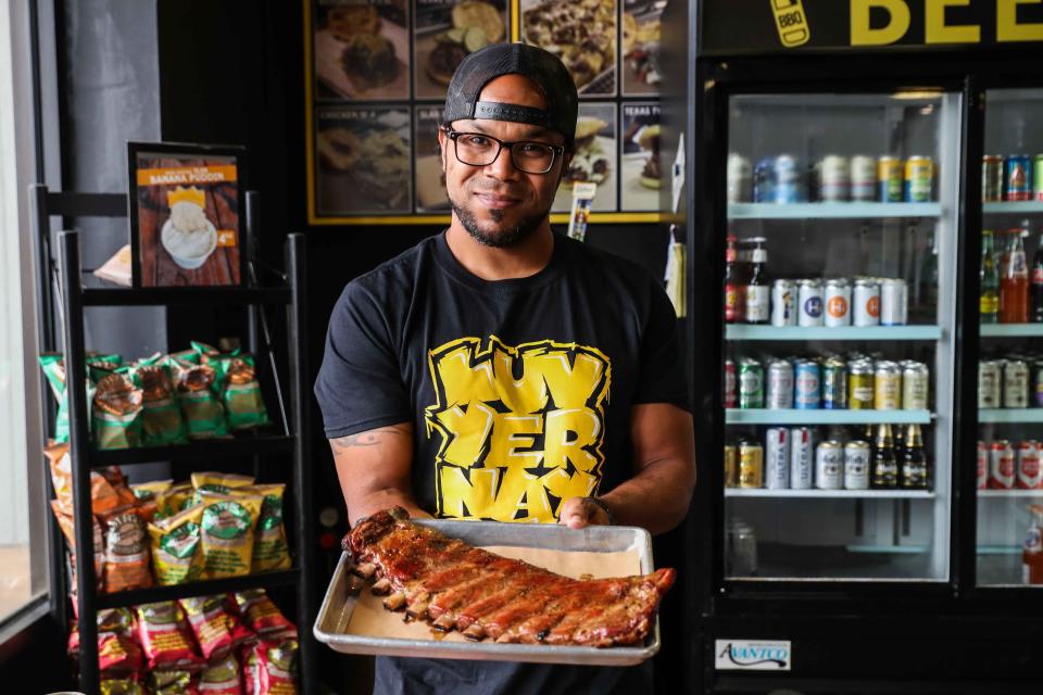 Raf Robinson poses at his restaurant Slab BBQ in Austin.