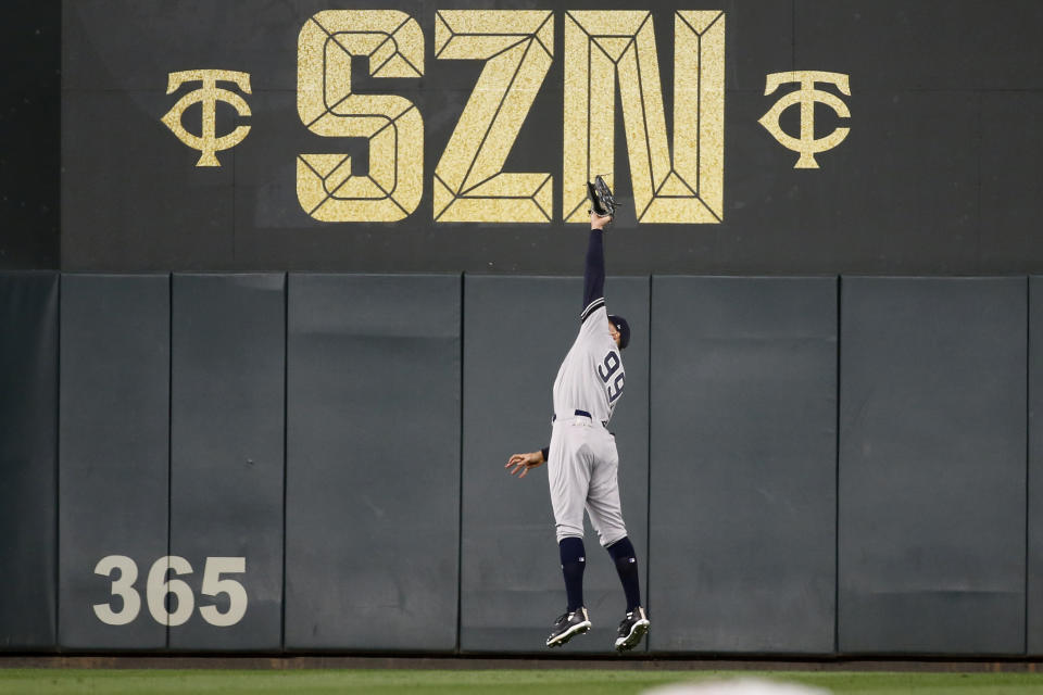 New York Yankees right fielder Aaron Judge catches a fly ball hit by Minnesota Twins' Miguel Sano during the sixth inning in Game 3 of a baseball American League Division Series, Monday, Oct. 7, 2019, in Minneapolis. (AP Photo/Bruce Kluckhohn)