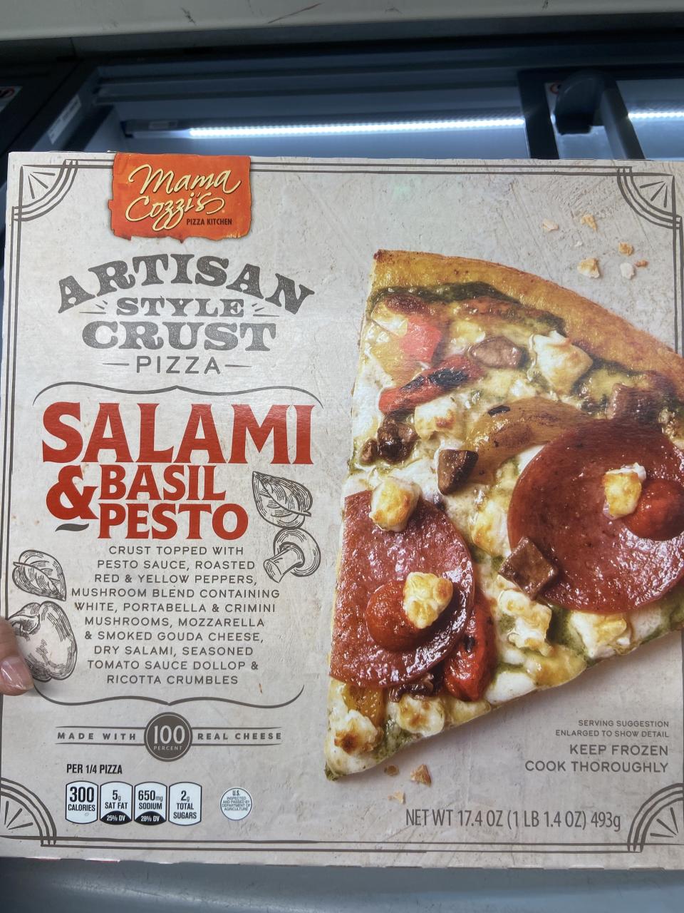 Box of pesto and salami pizza