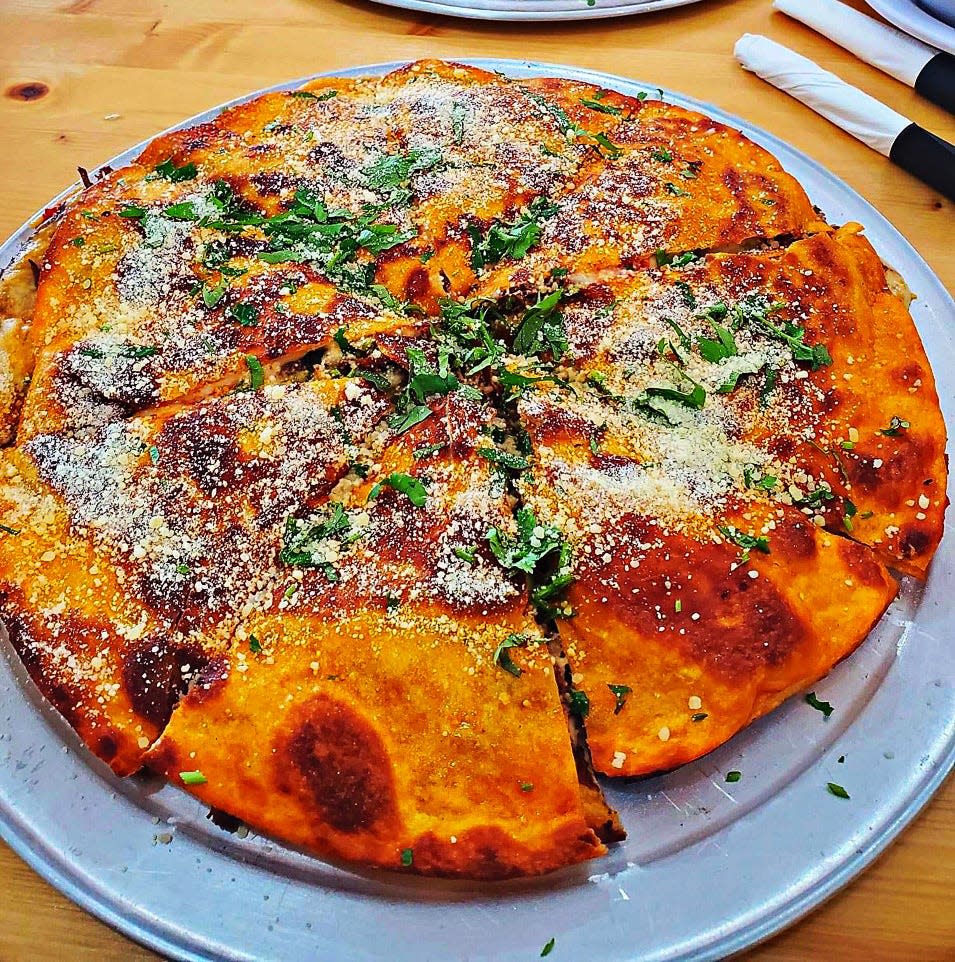 Birria pizza at El Agave Azul