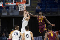 Penn State forward John Harrar (21) lays up the ball while Minnesota forward Isaiah Ihnen (35) defends during an NCAA college basketball game Wednesday, March 3, 2021, in State College, Pa. (Noah Riffe/Centre Daily Times via AP)