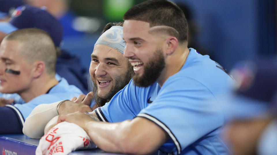 Bo Bichette and Alek Manoah, right, will be key to the Blue Jays' success down the stretch of the 2023 season. (Photo by Mark Blinch/Getty Images)