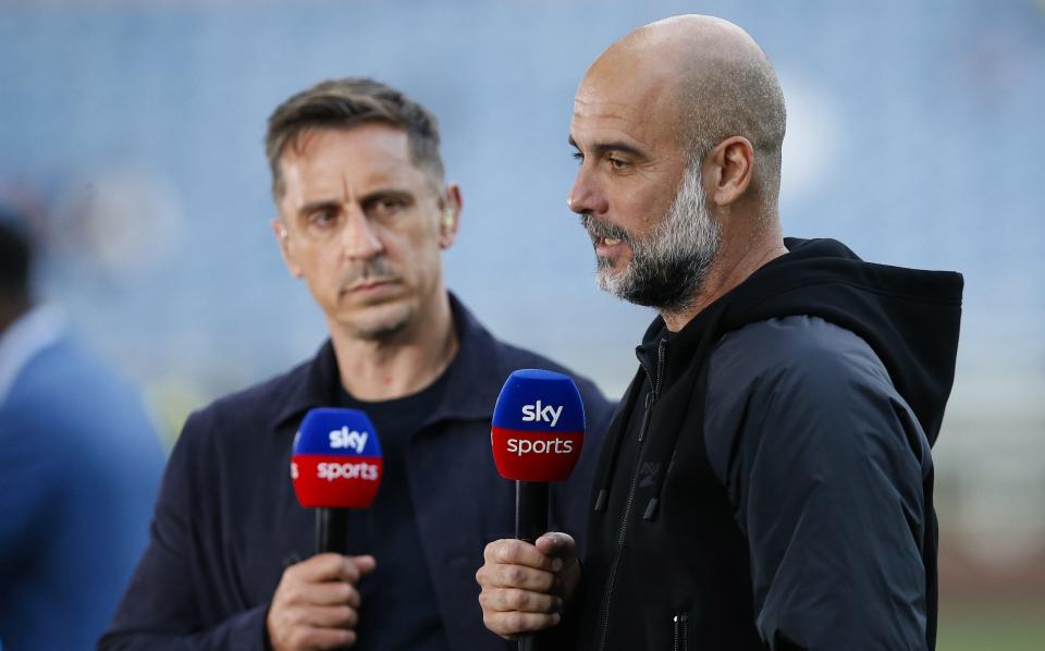 Manchester City manager Pep Guardiola with Sky Sports pundit Gary Neville before the Premier League match between Burnley FC and Manchester City at Turf Moor on August 11, 2023 in Burnley, England.