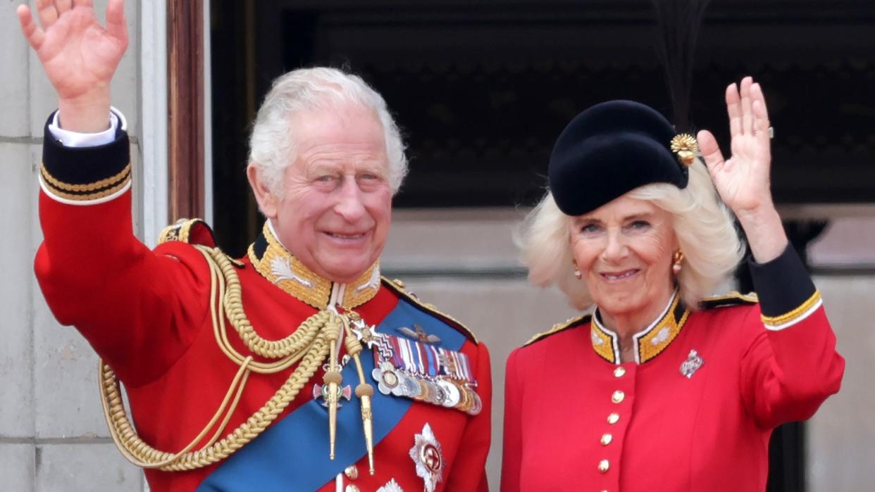 King Charles and Queen Camilla waving from the balcony of Buckingham Palace 