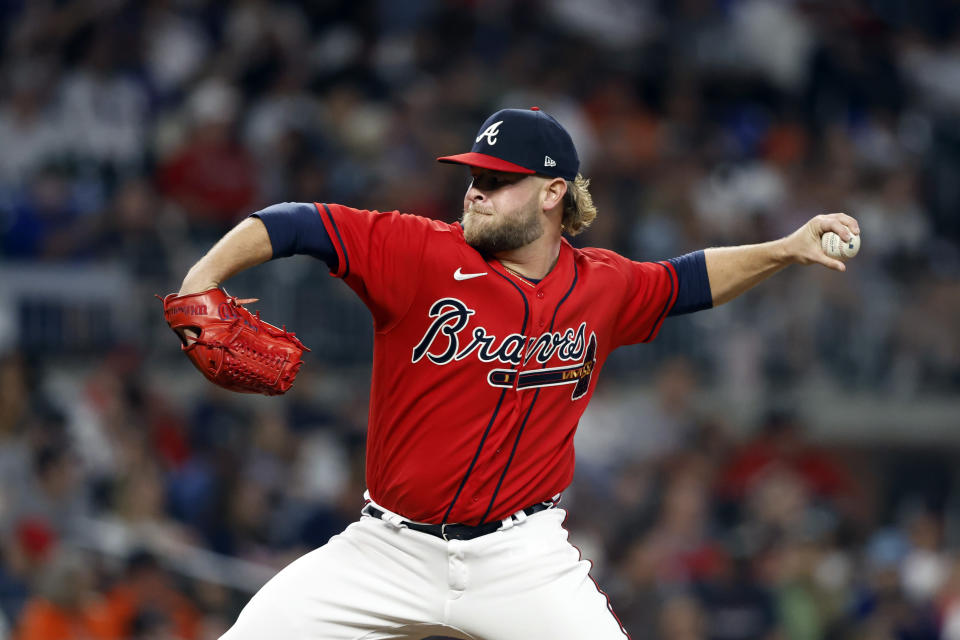 Atlanta Braves relief pitcher A.J. Minter throws during the ninth inning of the team's baseball game against the Houston Astros, Friday, April 21, 2023, in Atlanta. (AP Photo/Butch Dill)