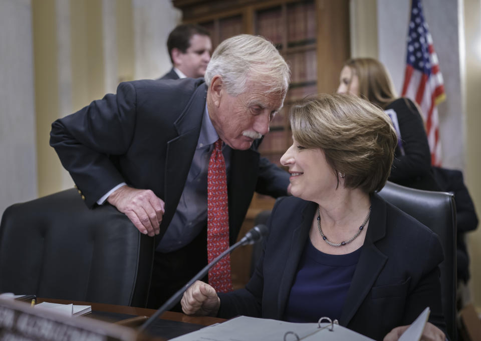 Sen. Angus King, I-Maine, left, confers with Sen. Amy Klobuchar, D-Minn., chair of the Senate Rules Committee, as the panel meets on the Electoral Count Reform and Presidential Transition Improvement Act, at the Capitol in Washington, Tuesday, Sept. 27, 2022. The bill is a response to the Jan. 6 insurrection and former President Donald Trump's efforts to find a way around the Electoral Count Act, the 19th-century law that, along with the Constitution, governs how states and Congress certify electors and declare presidential election winners. (AP Photo/J. Scott Applewhite)