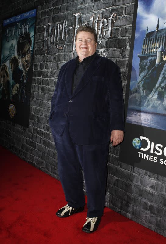 Cast member Coltrane arrives at event celebrating launch of "Harry Potter and the Deathly Hallows - Part 1" movie in DVD and digital formats, and opening of exhibition on movie, in New York City