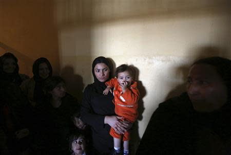 Afghan women prisoners stand in their room at Herat prison, western Afghanistan, December 8, 2013. REUTERS/Omar Sobhani