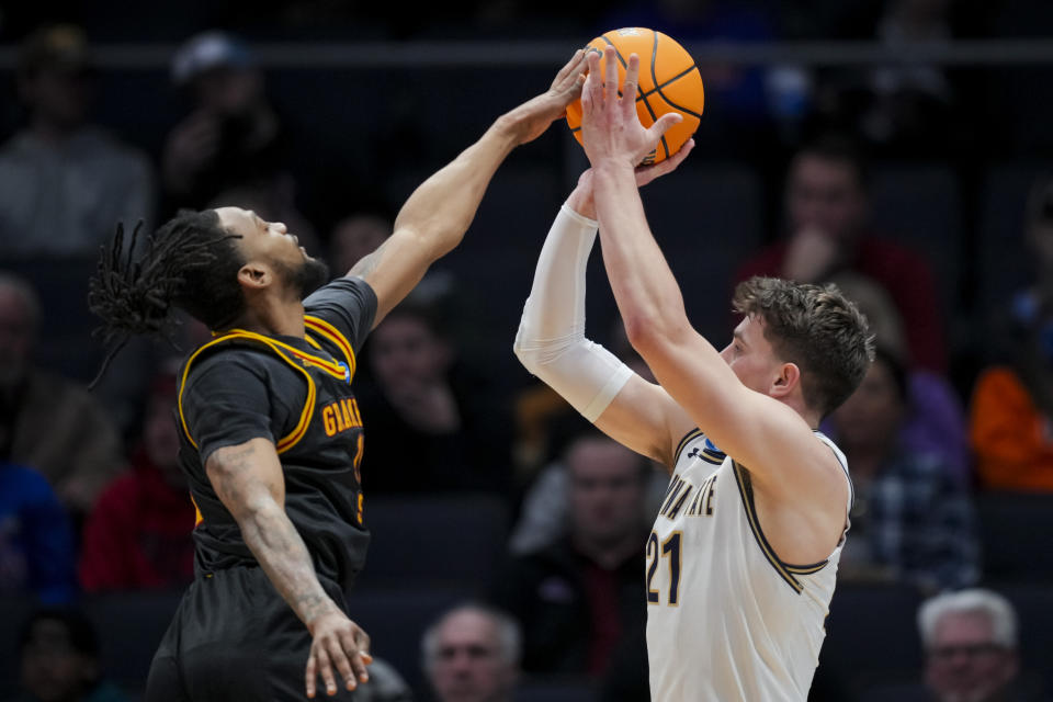 Montana State forward Brian Goracke, right, shoots against Grambling State guard Jourdan Smith during the first half of a First Four game in the NCAA men's college basketball tournament Wednesday, March 20, 2024, in Dayton, Ohio. (AP Photo/Aaron Doster)