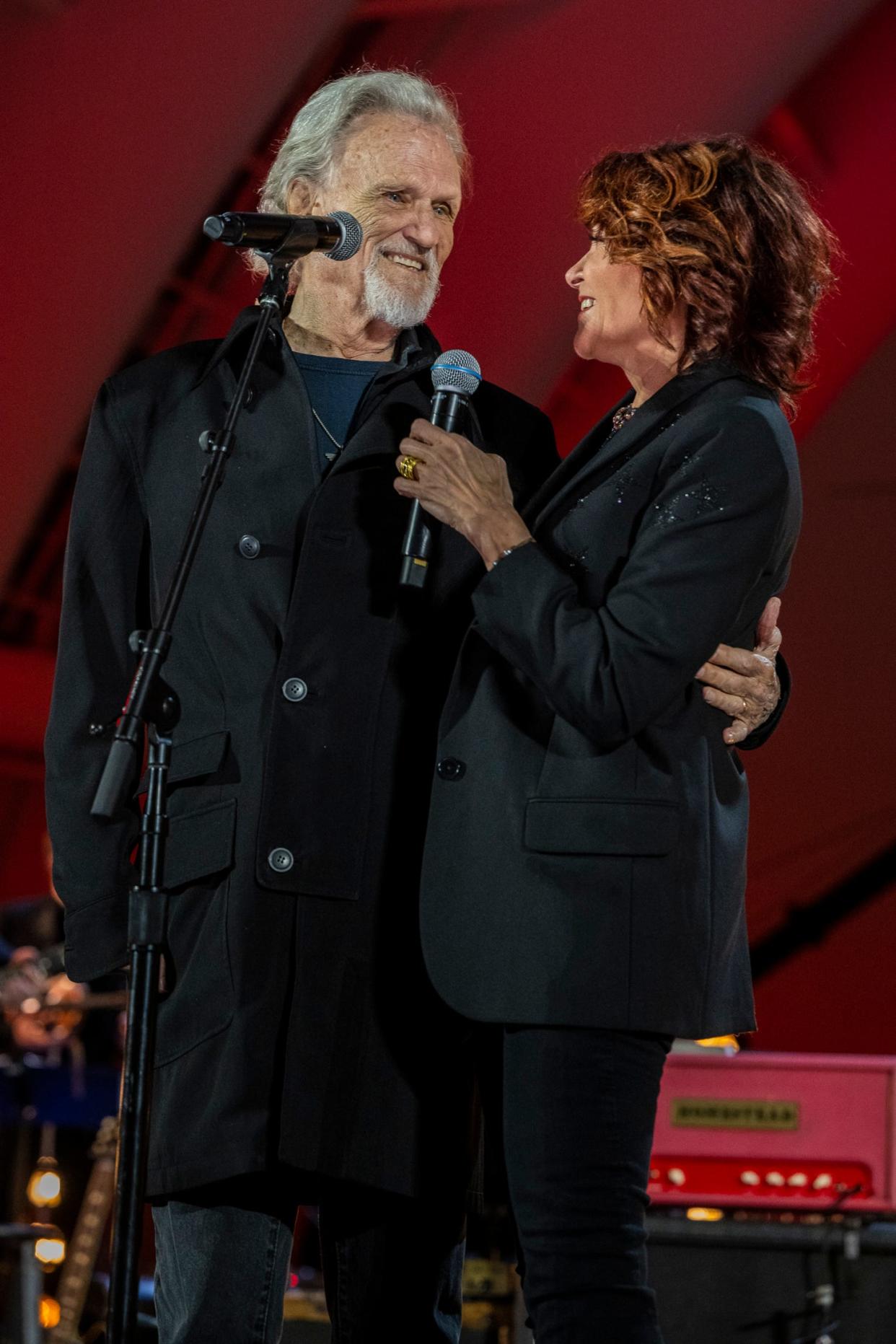 Kris Kristofferson and Rosanne Cash at Willie Nelson's birthday concert.