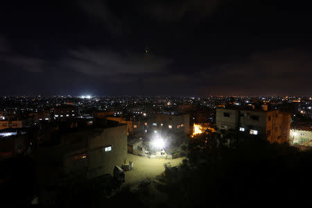 Buildings are seen at night in Gaza City, July 18, 2017. REUTERS/Mohammed Salem