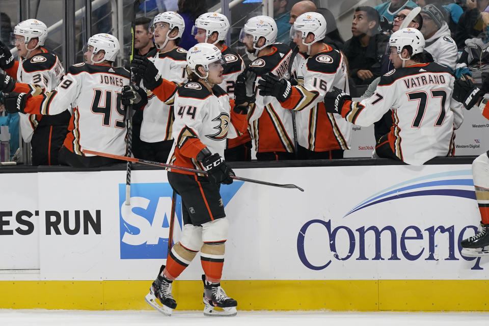 Anaheim Ducks left wing Max Comtois (44) is congratulated by teammates after he scored against the San Jose Sharks during the first period of an NHL hockey game in San Jose, Calif., Saturday, Nov. 5, 2022. (AP Photo/Jeff Chiu)