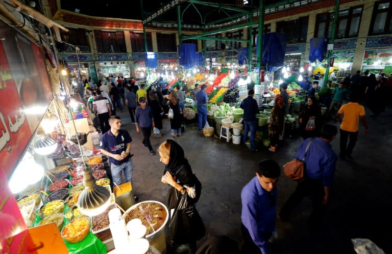 Iranians shop at the Tajrish bazaar in Tehran on June 7, 2016