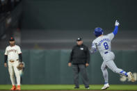 Los Angeles Dodgers' Enrique Hernández, right, runs the bases after hitting a solo home run against the San Francisco Giants during the seventh inning of a baseball game Monday, May 13, 2024, in San Francisco. (AP Photo/Godofredo A. Vásquez)