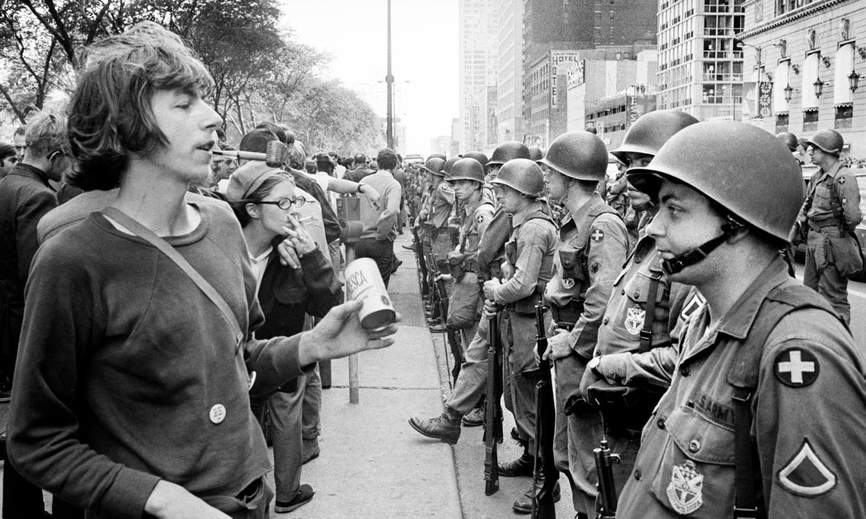 <span>National guard soldiers face off with demonstrators at Grant Park in Chicago on 26 August 1968. </span><span>Photograph: Universal History Archive/Universal Images Group/Getty Images</span>